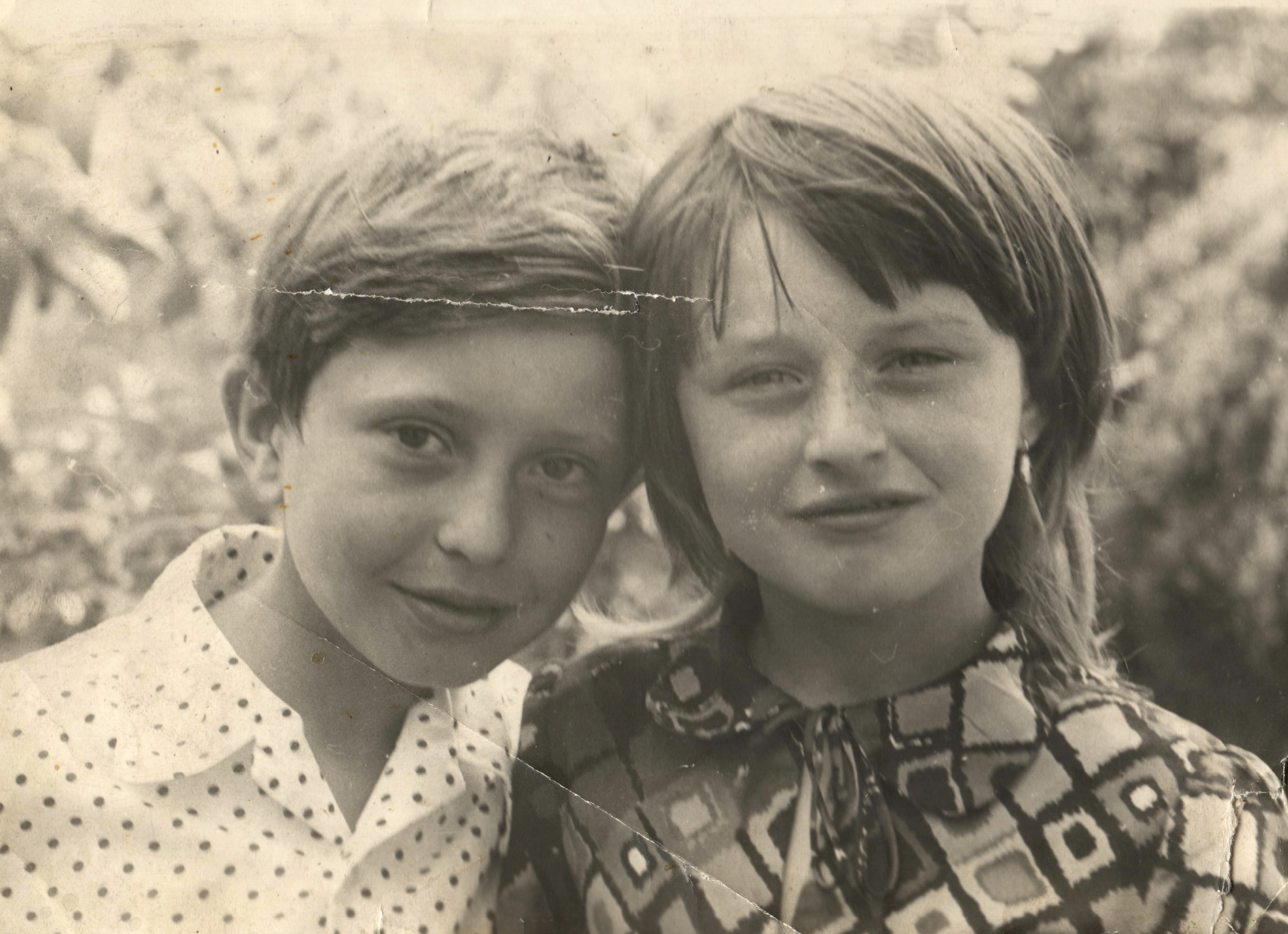 Two children being restored by AI — half before, half after